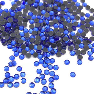 Sapphire HotFix Rhinestone SS7 https://www.artbeecrafts.com/products/copy-of-crystal-glass-hotfix-rhinestones-7ss-flatblack-1440pcs Hotfix Rhinestones are one of the easiest ways to add sparkle to your apparel designs, purses, cell phones, belts, dolls, scrapbooks, nail art, tumblers and much more! Stones are heat set and already have glue on the back. Easy to apply with hot fix applicator or a household iron.