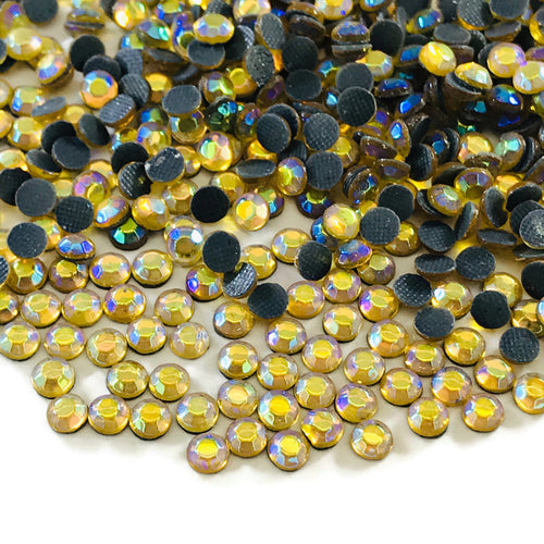AB Topaz Hotfix Rhinestones SS14 https://www.artbeecrafts.com/products/ab-topaz-glass-hotfix-rhinestones-ss16 Hotfix Rhinestones are one of the easiest ways to add sparkle to your apparel designs, purses, cell phones, belts, dolls, scrapbooks, nail art, tumblers and much more! Stones are heat set and already have glue on the back. Easy to apply with hot fix applicator or a household iron.