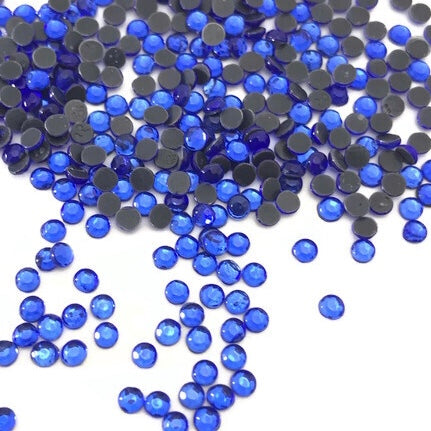 Sapphire HotFix Rhinestone SS7 https://www.artbeecrafts.com/products/copy-of-crystal-glass-hotfix-rhinestones-7ss-flatblack-1440pcs Hotfix Rhinestones are one of the easiest ways to add sparkle to your apparel designs, purses, cell phones, belts, dolls, scrapbooks, nail art, tumblers and much more! Stones are heat set and already have glue on the back. Easy to apply with hot fix applicator or a household iron. www.ArtBeeCrafts.com